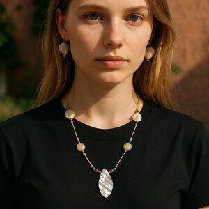 Oysters and the beach. Oyster Pearl Floating pendant necklace. Medium length wit